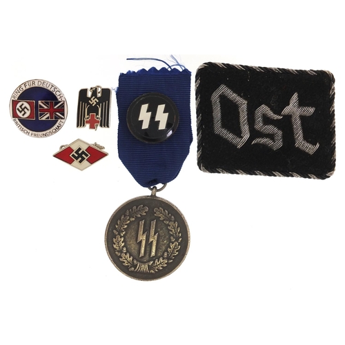 2321 - German military interest objects including three enamel badges, cloth patch and medal