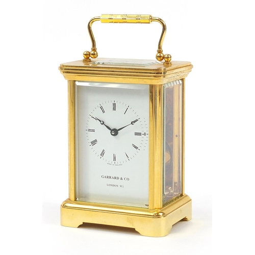 407 - Garrard & Co, brass cased carriage clock having Roman numerals with box and valuation, the carriage ... 