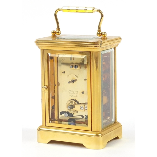 407 - Garrard & Co, brass cased carriage clock having Roman numerals with box and valuation, the carriage ... 