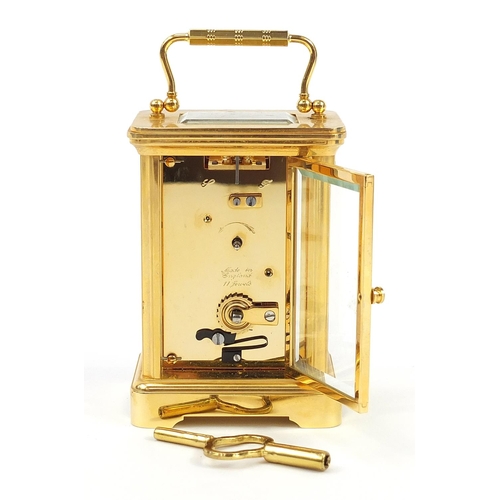 407 - Garrard & Co, brass cased carriage clock having Roman numerals with box and valuation, the carriage ... 