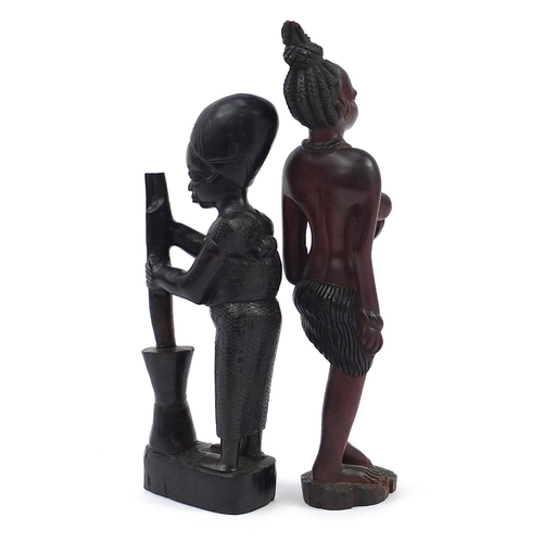 983 - Two African hardwood carvings of tribespeople  including a nude female, the largest 40cm high