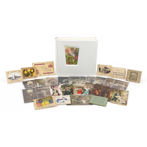 2185 - Postcards and ephemera, some arranged in an album including greetings and topographical examples