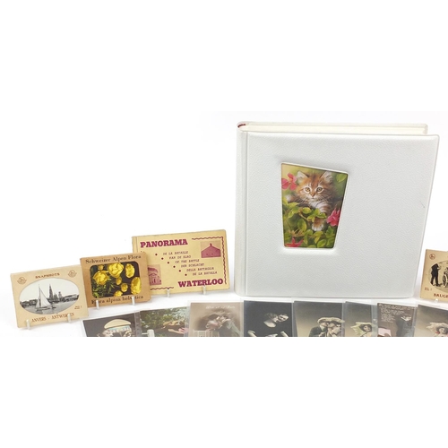 2185 - Postcards and ephemera, some arranged in an album including greetings and topographical examples