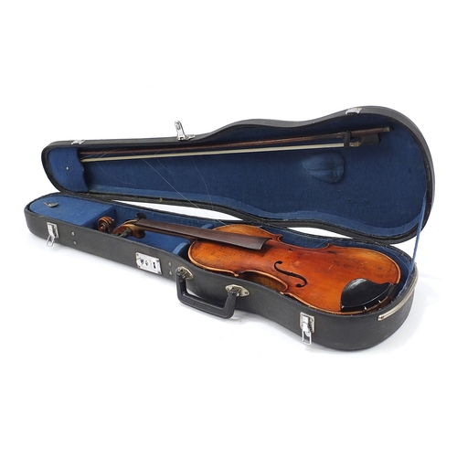 411A - German violin with two piece back, bow and case, the violin bearing a Stradivarius paper label, the ... 