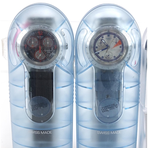 2205 - Swatch, two Swatch Irony Diaphane wristwatches and a Swatch Beat aluminium wristwatch, with cases