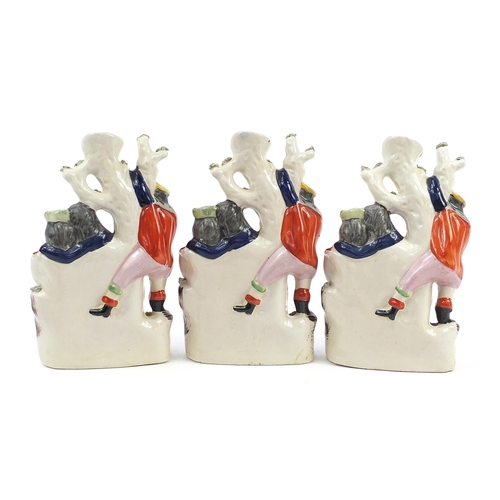 1069 - Three Staffordshire style flatback figural vases, each titled The Rival, each 30cm high