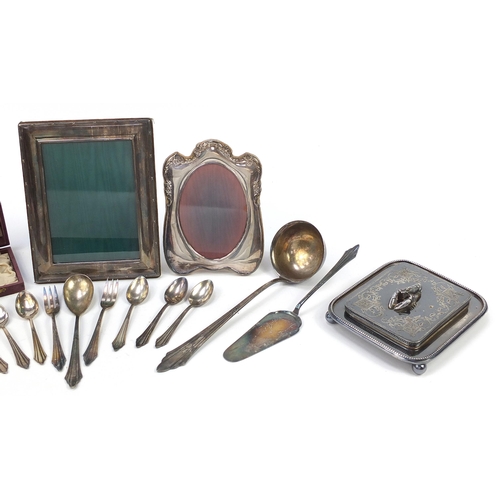 687 - Silver plated sundry items including WMF cutlery, butter dish with lobster knop and two easel photo ... 