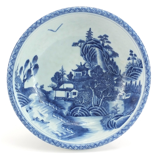 156 - Chinese blue and white porcelain footed bowl hand painted with figures crossing a bridge in a river ... 