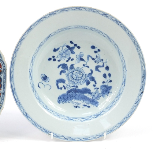 487 - Two Chinese porcelain plates and a blue and white porcelain soup bowl hand painted with flowers, the... 