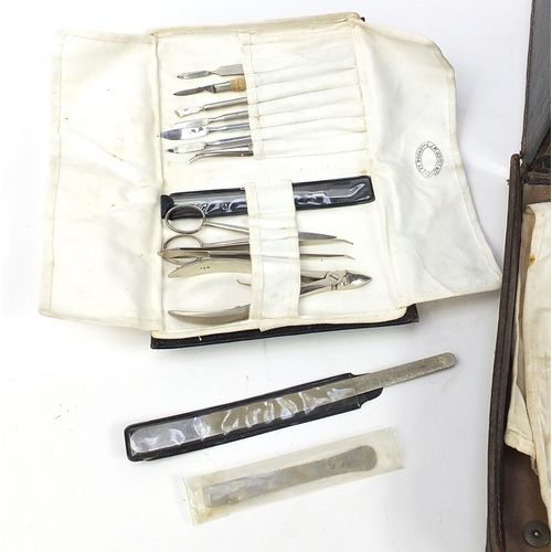 395 - Vintage leather doctor's travelling medical case with various implements, lift up top and fold down ... 