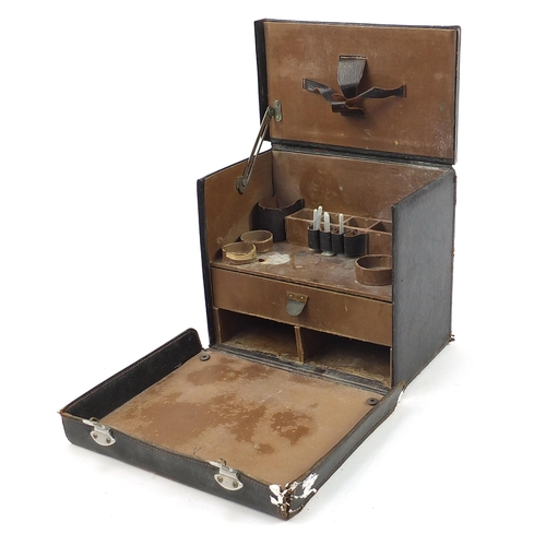 395 - Vintage leather doctor's travelling medical case with various implements, lift up top and fold down ... 