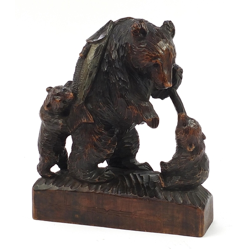 50 - Large Black Forest carving of three bears and a fish, 37cm high