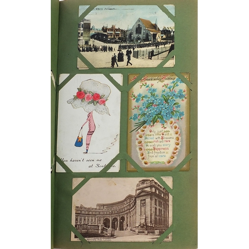 1510 - Topographical greetings and comical postcards arranged in an album including Donald McGill, street s... 