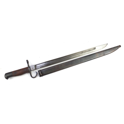 2363 - Military interest bayonet with scabbard, impressed mark to the steel blade, 52.5cm in length