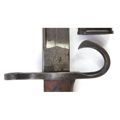 2363 - Military interest bayonet with scabbard, impressed mark to the steel blade, 52.5cm in length