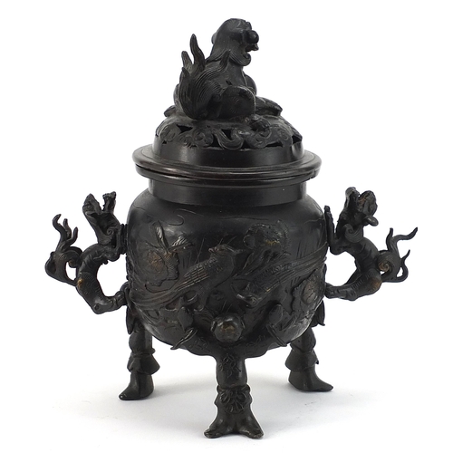 488 - Japanese patinated bronze tripod incense burner with dragon handles and pierced lid, 21.5cm high