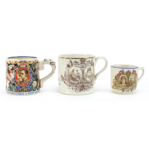 655 - Three commemorative mugs and cups including one designed by Laura Knight, the largest 8.5cm high