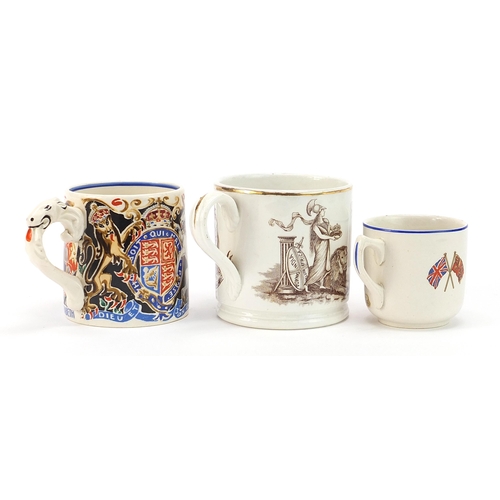 655 - Three commemorative mugs and cups including one designed by Laura Knight, the largest 8.5cm high