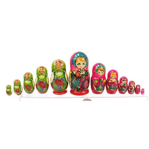 670 - Four Russian Matryoshka hand painted stacking dolls, the largest 21cm high