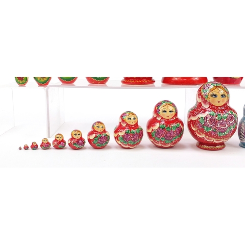 670 - Four Russian Matryoshka hand painted stacking dolls, the largest 21cm high