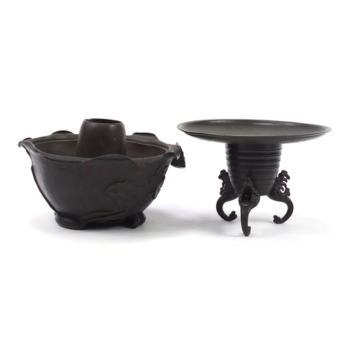 232 - *WITHDRAWN*Japanese tripod incense burner and a pottery warmer, the largest 22.5cm in diameter