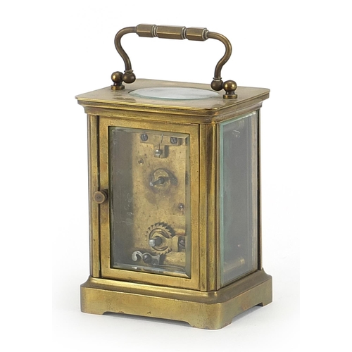 913 - French brass cased carriage clock with enamelled dial having Roman numerals, 11cm high