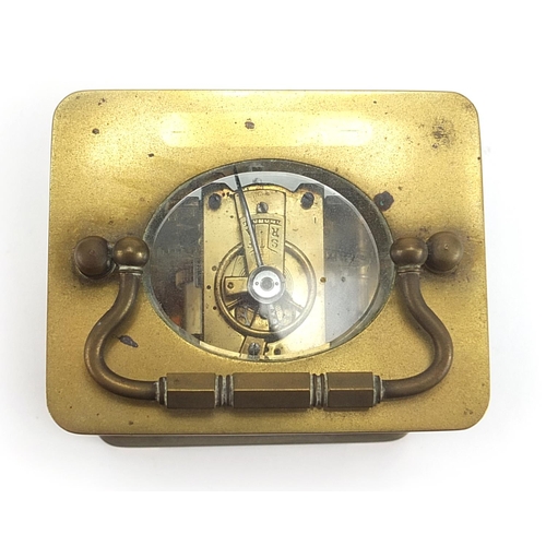 913 - French brass cased carriage clock with enamelled dial having Roman numerals, 11cm high