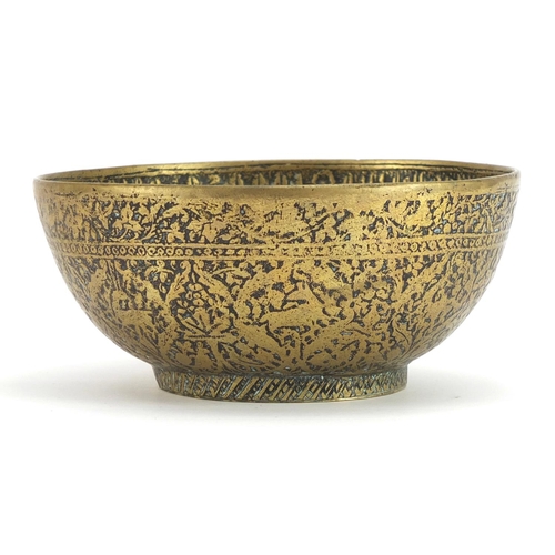 1083 - Islamic brass bowl engraved with wild animals and calligraphy, 14cm in diameter