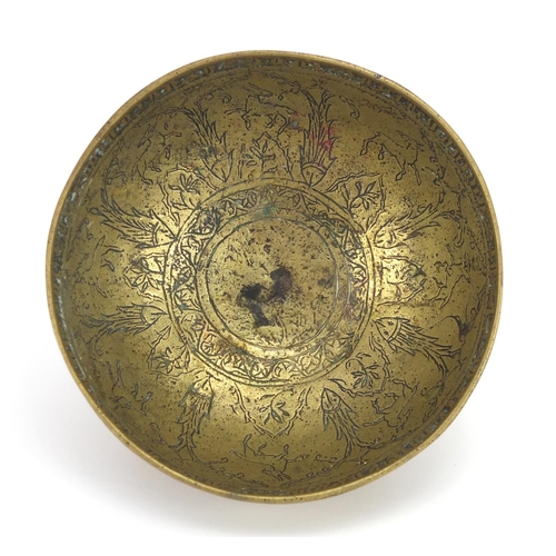 1083 - Islamic brass bowl engraved with wild animals and calligraphy, 14cm in diameter