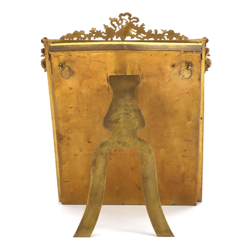 306 - 19th century gilt brass easel photo frame mounted with swags, impressed Stern Brothers New York to t... 