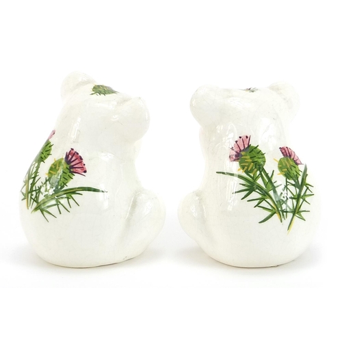 657 - Pair of Plichta pottery koala salt and pepper shakers hand painted with thistles, 8cm high