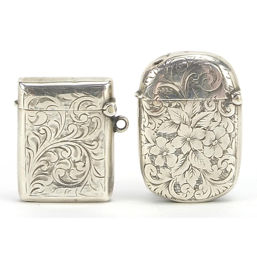 2259 - Two Victorian and later silver vestas with engraved decoration, Birmingham 1892 and 1906, the larges... 