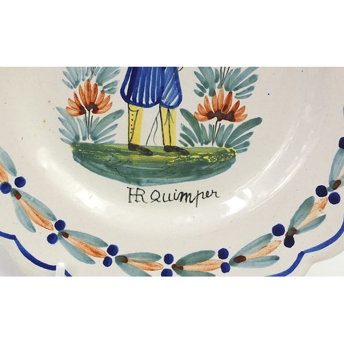 495 - French faience glazed pottery including Quimper plates and a Fourmain Evaux Desvres plate hand paint... 