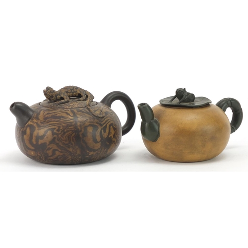 977 - Two Chinese Yixing terracotta teapots including a marbleised design example with lizard knop, charac... 