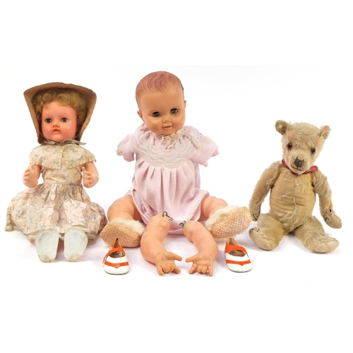 1360 - Two Rosebud and Pedigree vintage dolls and a golden articulated teddy bear, the largest 50cm high