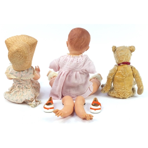 1360 - Two Rosebud and Pedigree vintage dolls and a golden articulated teddy bear, the largest 50cm high