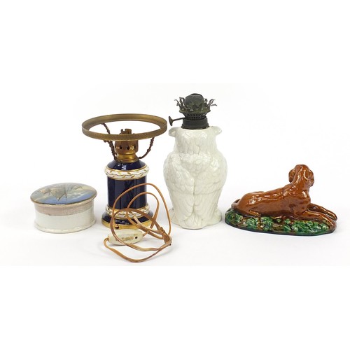 1127 - Victorian ceramics including Prattware pot lids, Majolica seated dog and owl oil lamp base, the larg... 