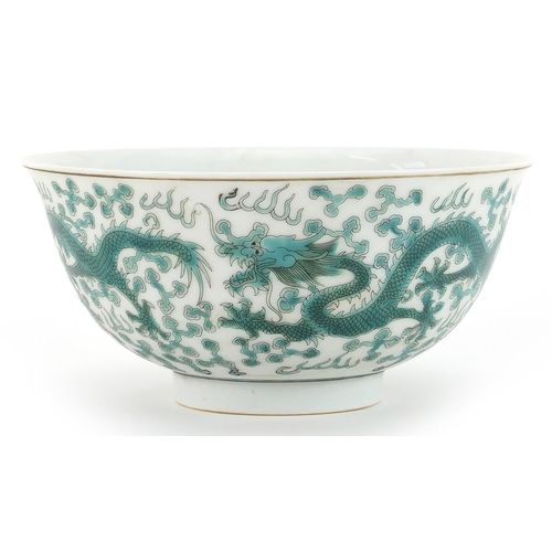 498 - Chinese porcelain bowl decorated in green with dragons chasing a flaming pearl amongst clouds, six f... 