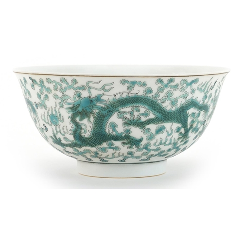 498 - Chinese porcelain bowl decorated in green with dragons chasing a flaming pearl amongst clouds, six f... 