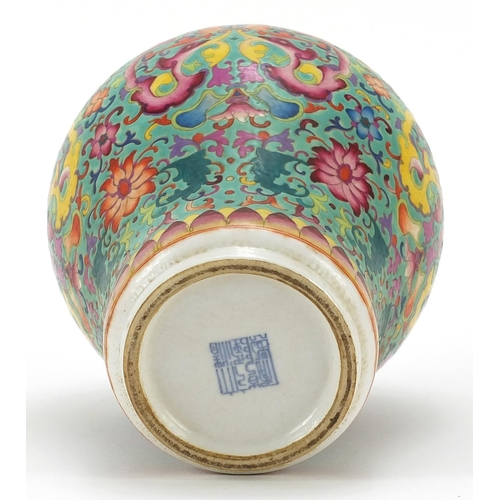 528 - Chinese porcelain baluster vase and cover hand painted in the famille rose palette with flowers amon... 