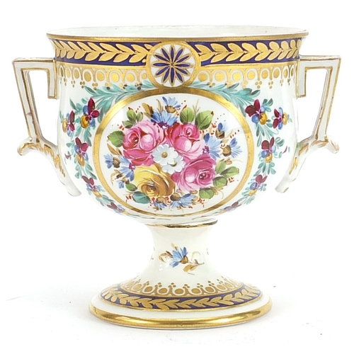 262 - Dresden, German porcelain pedestal cup with twin handles hand painted and gilded with flowers, 11.5c... 