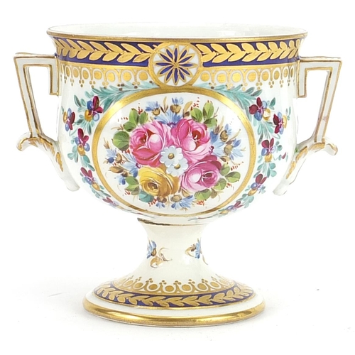 262 - Dresden, German porcelain pedestal cup with twin handles hand painted and gilded with flowers, 11.5c... 