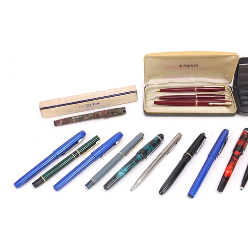 190 - Vintage and later pens and pencils including a large white metal example housed in a hardwood case w... 