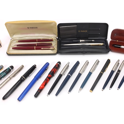 190 - Vintage and later pens and pencils including a large white metal example housed in a hardwood case w... 