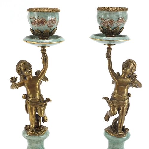 502 - Pair of French style classical porcelain and bronze Putti design candlesticks, each 36cm high