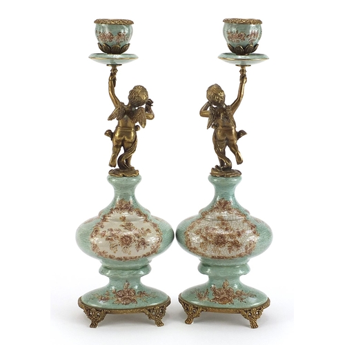 502 - Pair of French style classical porcelain and bronze Putti design candlesticks, each 36cm high