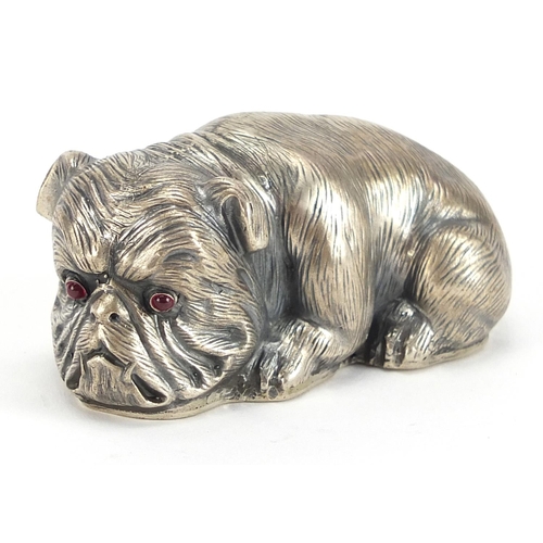 2263 - Silver model of a recumbent Bulldog with ruby eyes, impressed Russian marks, 6.5cm in length, 60.5g