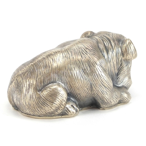 2263 - Silver model of a recumbent Bulldog with ruby eyes, impressed Russian marks, 6.5cm in length, 60.5g