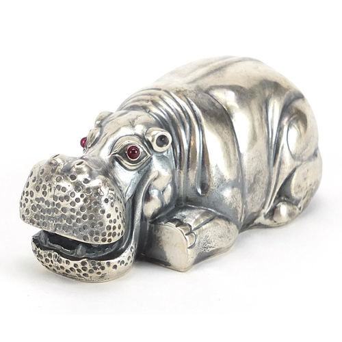 2226 - Silver model of a recumbent hippopotamus with ruby eyes, impressed Russian marks, 7.5cm in length, 7... 