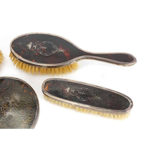 2275 - George V five piece silver and tortoiseshell pique work dressing table set, possibly by Corke & Apth... 